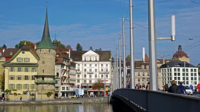 Buses and cars on the city road and old houses, Lucerne, Switzerland