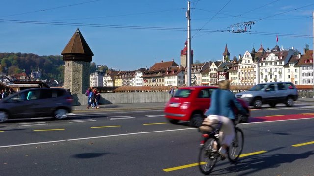 Buses and cars on the city road and old houses, Lucerne, Switzerland