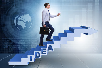 Concept of idea with businessman climbing steps stairs
