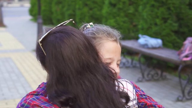 a disabled woman and Daughter rushes into mother's arms