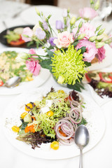 Greek salad with juicy tomatoes, feta cheese, lettuce, green olives, cucumber, red onion and fresh parsley. Homemade food. Symbolic image. Concept for a tasty and healthy vegetarian meal. Close up