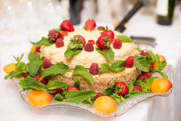 delicious cake with strawberries, peach and raspberrie.