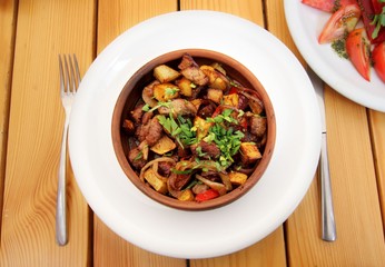 Ojakhuri with fried potatoes and meat - traditional georgian food