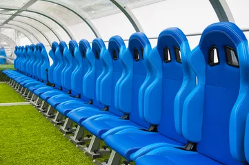 Keuken foto achterwand Voetbal Blauwe bank of stoel of stoel van personeelscoach in het voetbalstadion