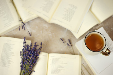 Opened books lavender flowers, vintage tea cup