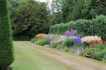 Flower beds and lawn in formal garden