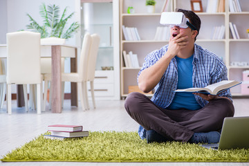 Freelance student with virtual reality glasses at home