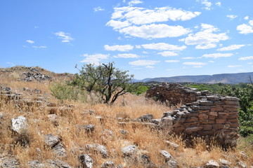 Western landscape with native american stone ruins