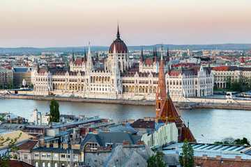 Obraz premium Sunset in Budapest. View of hungarian parliament, the most beautiful building in Europe in neo-gothic style. 