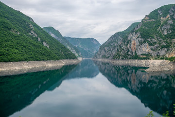 The picturesque turquoise lake is among the high mountains.