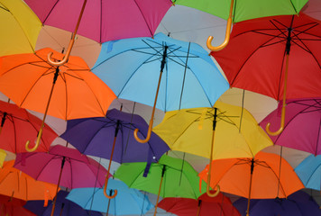 Fototapeta na wymiar many multicolored open umbrellas
