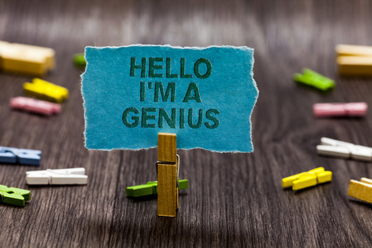 Text sign showing Hello I am A Genius. Conceptual photo Introduce yourself as over average person to others Clips symbol idea script notice board text capital cardboard design.