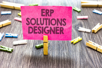 Writing note showing Erp Solutions Designer. Business photo showcasing elegant optimized modularised and reusable possible Multiple clips woody table small card clipped notice announcement.