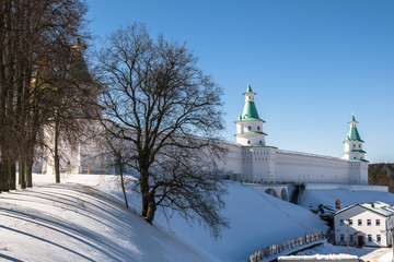 The fortress walls with towers around the New Jerusalem Monastery of the 17th century. Istra, Moscow suburbs, Russia.