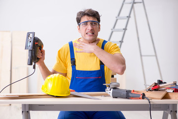 Floor repairman disappointed with his work 