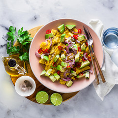 grilled corn , avocado salad with blue onion and chili pepper. healthy summer breakfast or lunch. copy space