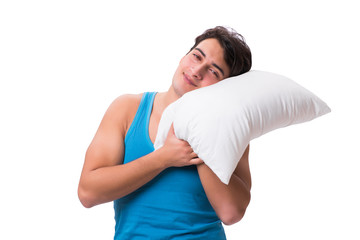 Young man with pillow isolated on white background