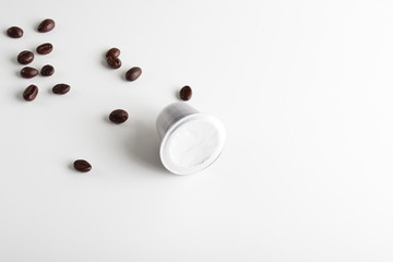 Obraz na płótnie Canvas capsules of coffee on a white background