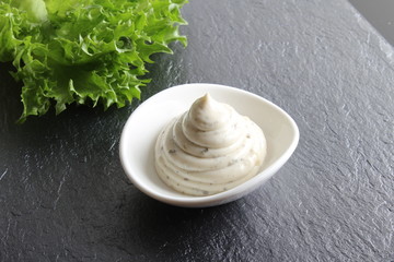 mayonnaise sauce, sour cream on a stone background