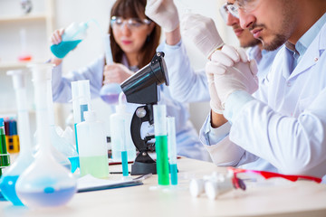 Team of chemists working in the lab