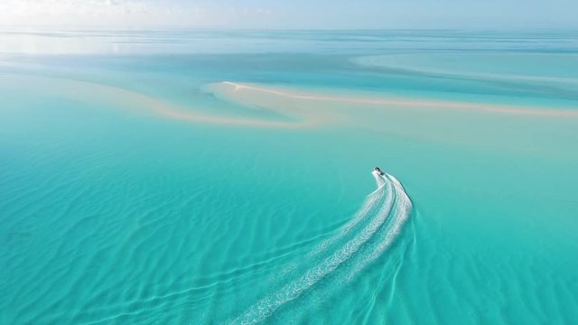 Boat Approaches incredible white sand bank in the bahamas