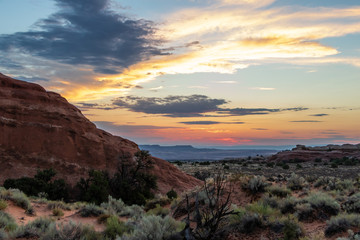 Fototapeta premium Sunrise over the Devil's Garden in Arches National Park, Utah