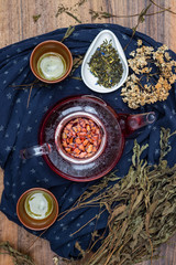 Asian tea ceremony. Japanese, Chinese and Thai traditional tea ceremony with pot and small cups. Herbal green and black Chinese tea leaves, aromatic drink, authentic