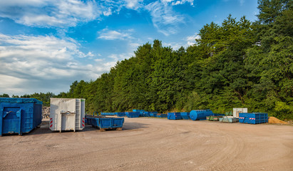 Recycling yard with different containers.