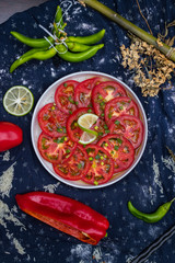 Asian tomato salad with soy sauce and red hot chilly pepper. Thai and Indonesian traditional food menu in cafe or restaurant. Raw vegan vegetarian healthy food. Paleo diet