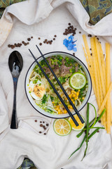 Ramen noodle soup with egg, corn and meat in bowl. Asian Thai traditional authentic food with vegetables served in cafe or restaurant
