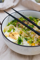 Ramen noodle soup with egg, corn and meat in bowl. Asian Thai traditional authentic food with vegetables served in cafe or restaurant