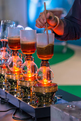 Siphon vacuum coffee maker and coffee grinder with drip brewing filtered coffee or pour-over is a method involves pouring hot water over roasted coffee beans contained in a filter old tradition