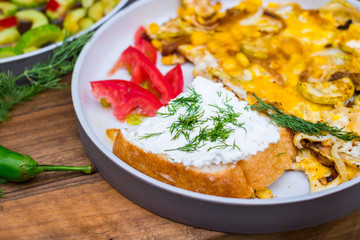 Thai fried omelet eggs with toast tofu spread for breakfast. Asian authentic food at asian cafe