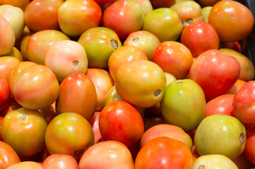 Tomato pile on sale in supermarket