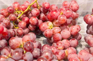 Ripe red grapes on sale in supermarket