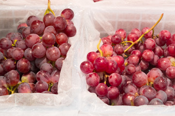 Ripe red grapes on sale in supermarket