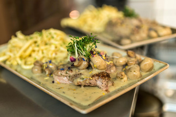 Spaetzle german baked gnocchi with chicken meat, champignons mushrooms asparagus and cheese