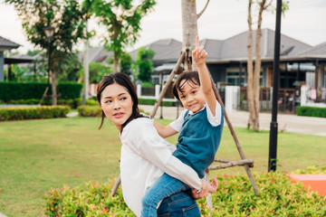 Family happy children kid son boy kindergarten ride back piggyback mother mom