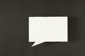 Symbol sign message from a white paper on a black background, social network, message, symbol