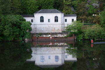 Reflection of a house on the Lot river in Cahors