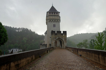 Along the Pont Valentre bridge in a rainy day