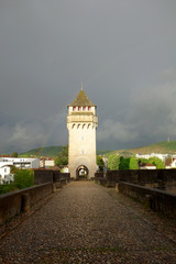 apocalyptic Pont Valentre bridge in Cahors in a rainy day