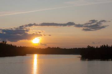 sunset over a forest lake