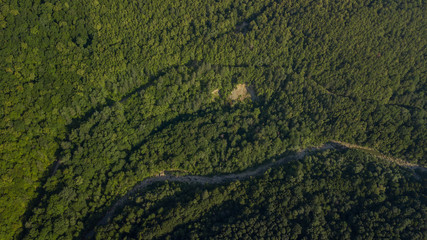 Russian Forest And Mountains Under Blue Sky By Aerial Drone. Stunning Aerial Drone Stock Footage of South russian Forest And Mountains Under Blue Sky