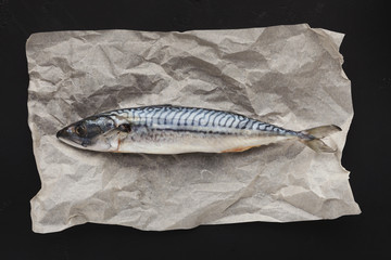 Raw fish on parchment, top view
