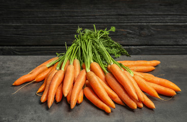 Ripe carrots on grey table. Healthy diet