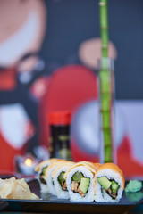 Sushi avocado and kale and wasabi on plate