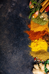 Spices and herbs on a dark background