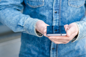 Close Up Hipster Business Man Using Smart Mobile Phone App Outdoor Black Oled Display Background Denim Jeans shirt Stylish Dressed