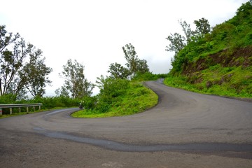 Green landscape surrounded by hills, mountains in monsoon season 